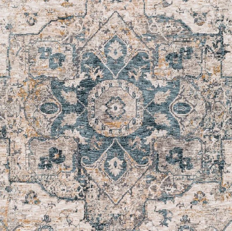 Cream-colored rug with a central, ornate design in teal, gold, and gray.