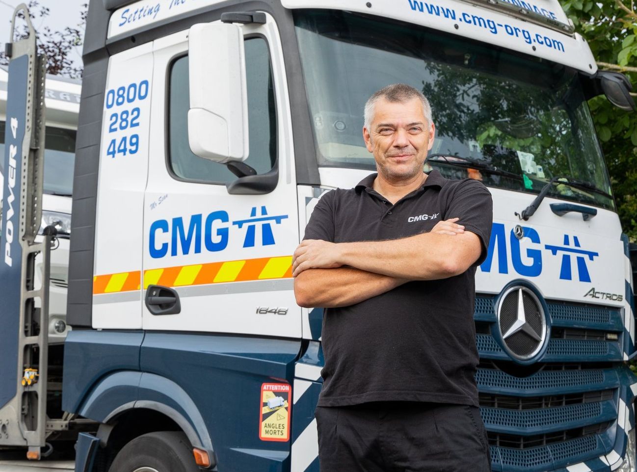 Man standing in front of a CMG truck