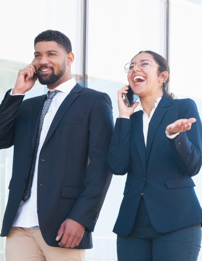 A woman is talking on a cell phone while holding a tablet.