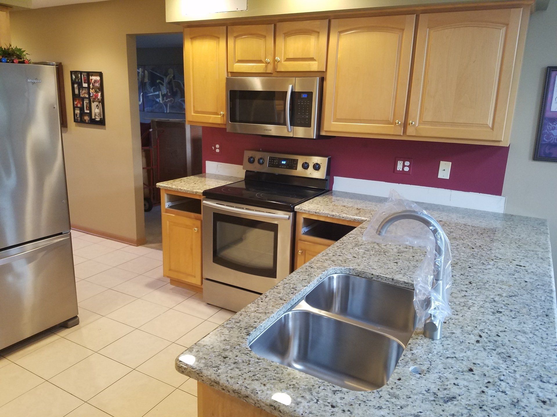 Granite countertops next to stove and microwave oven in Wisconsin home