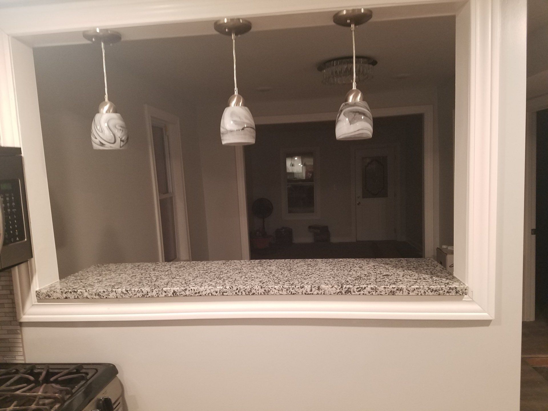 Granite countertop next to lights in Chicago apartment