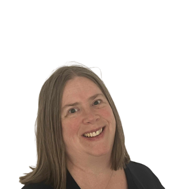 Woman with long light-brown hair smiling, looking towards the viewer. Black top, white background.