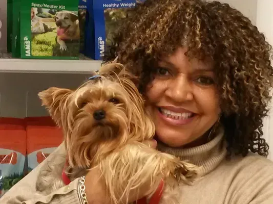 Woman with a Yorkshire Terrier — College Park, GA — Red Oak Animal Hospital