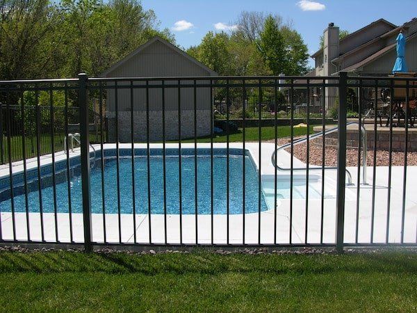 Fence with Pool Inside — Chesterfield, MI — Radiance Aluminum Fence, Inc.