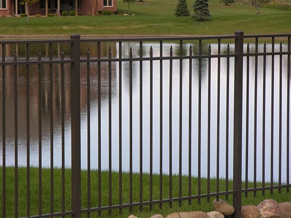 Simple Fence Near Water — Chesterfield, MI — Radiance Aluminum Fence, Inc.