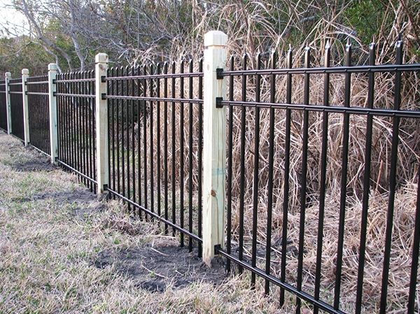 Fence with Wooden Post — Chesterfield, MI — Radiance Aluminum Fence, Inc.