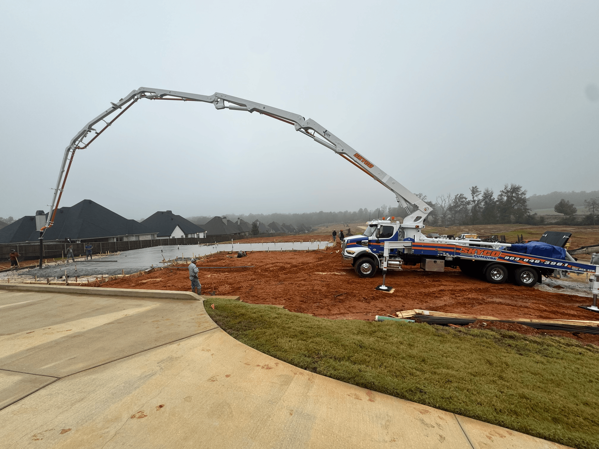 skyco pumping concrete truck at jobsite