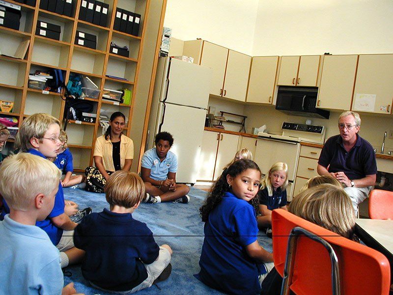 children seated in nontraditional school