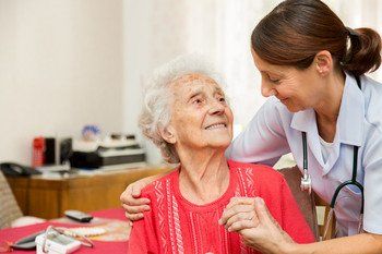Female doctor examines her senior patient