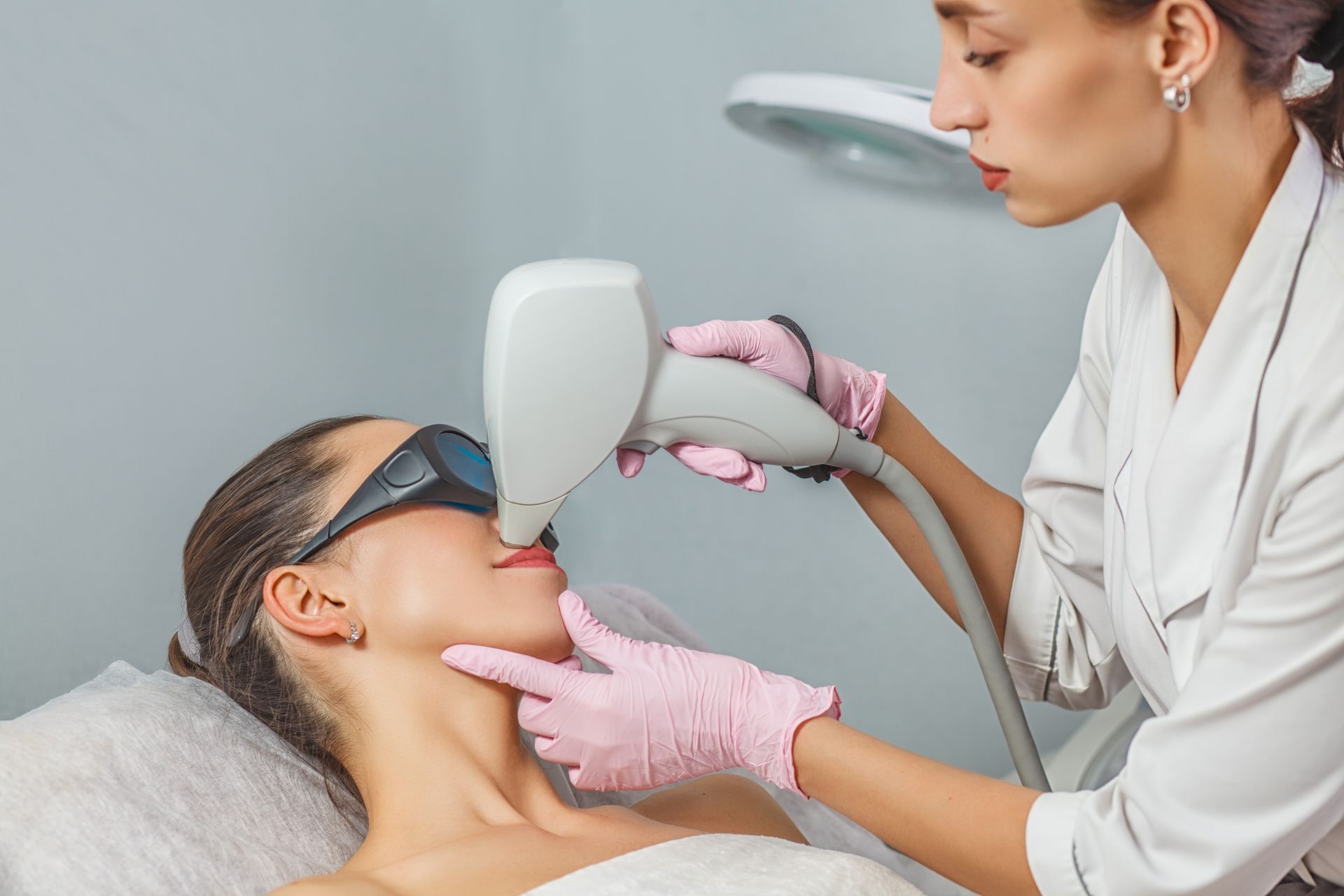 woman receives pigment correction treatment