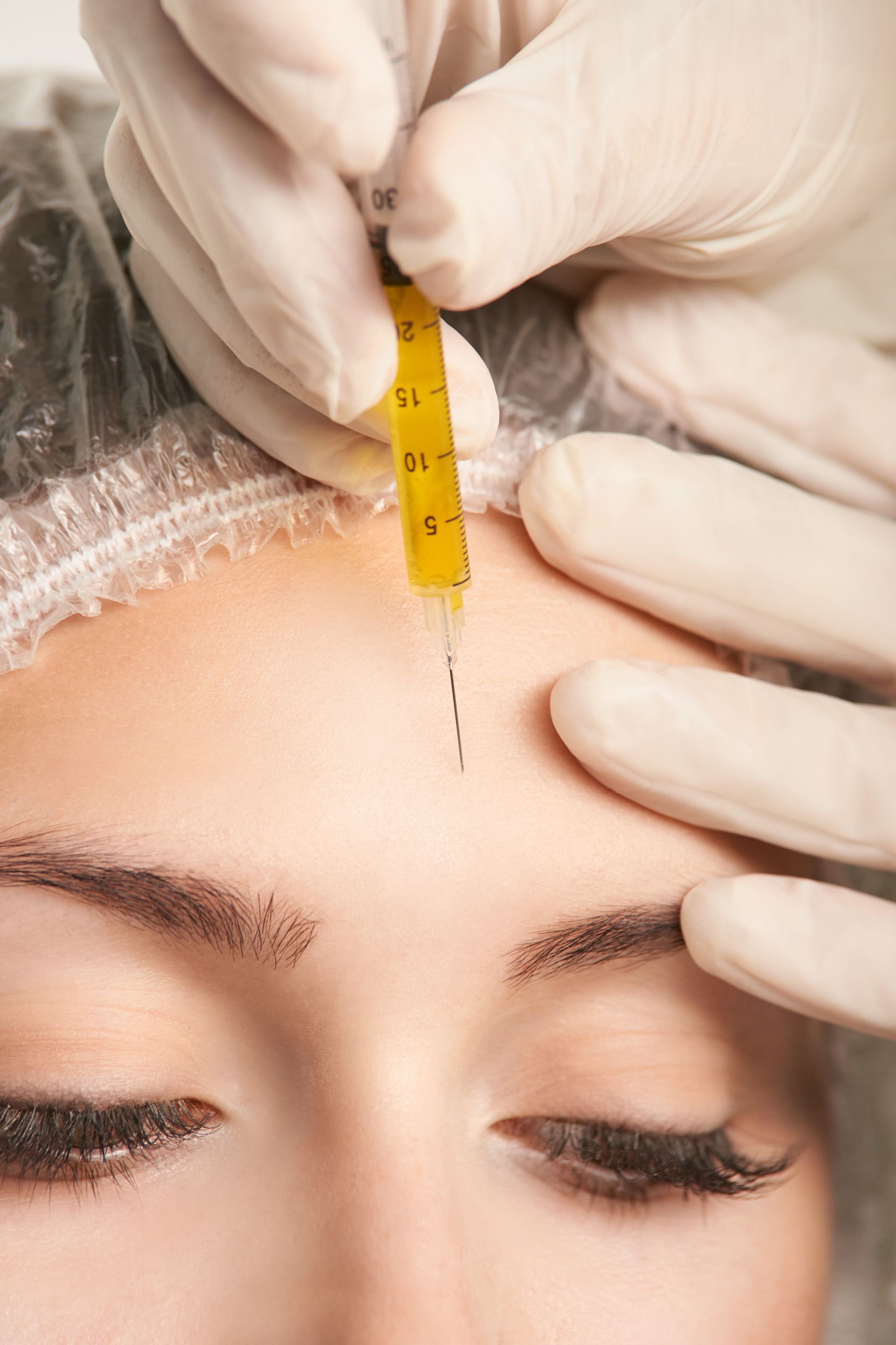 woman receives facial skin rejuvenation treatment