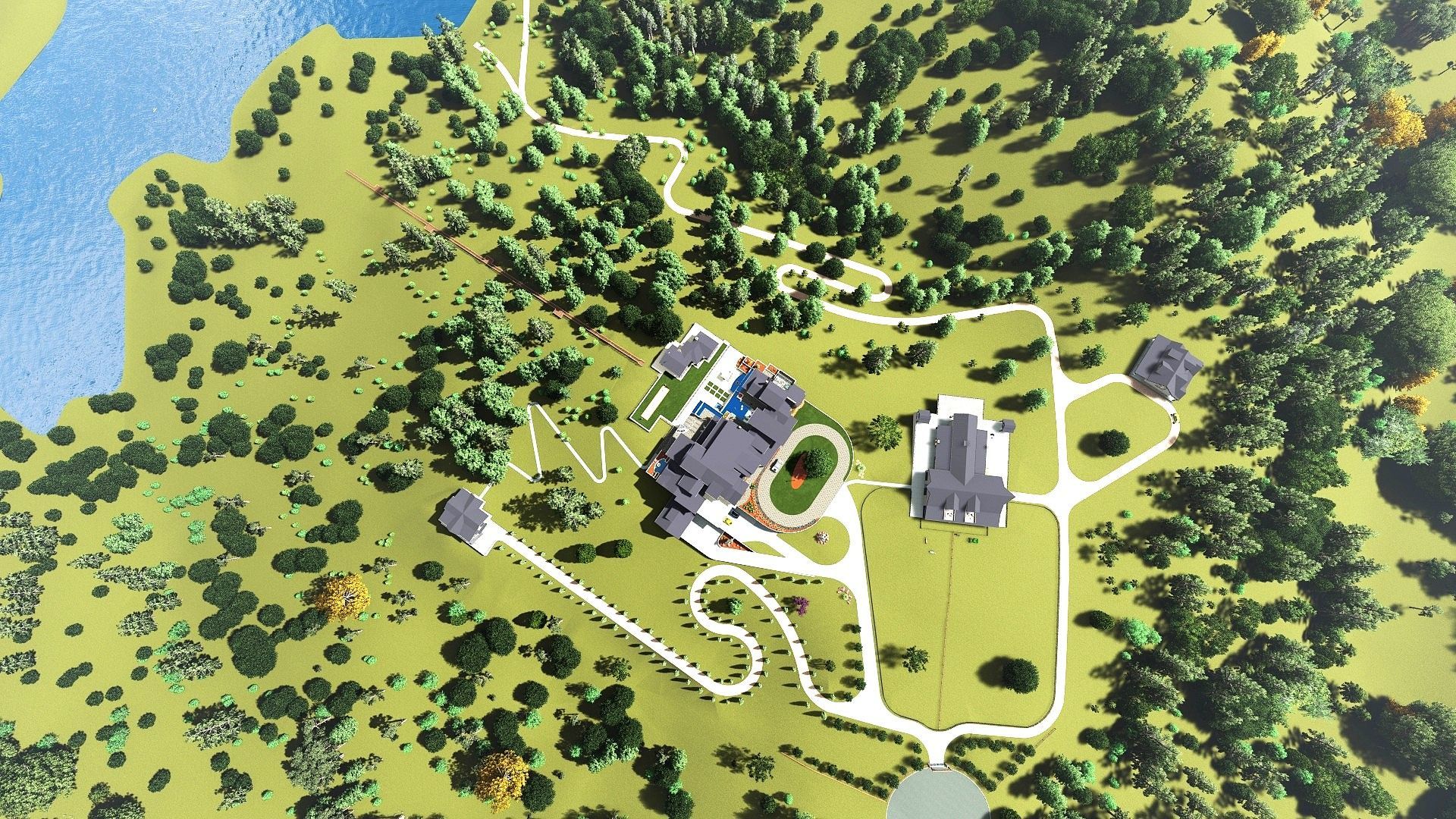 Aerial view of a large estate with buildings, a winding road, trees, and a lake.