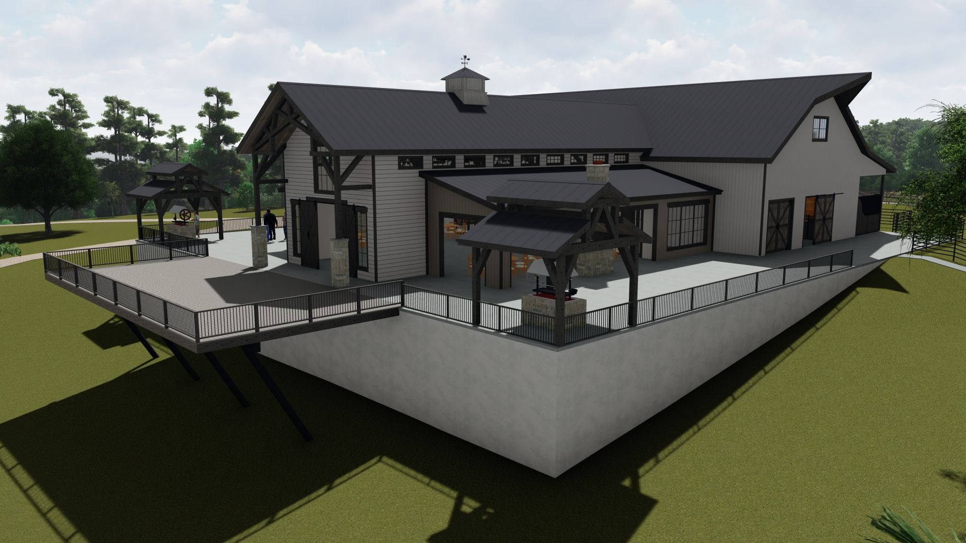 Modern house with a large deck. The structure is gray and black with a dark roof, set on a grassy hill.