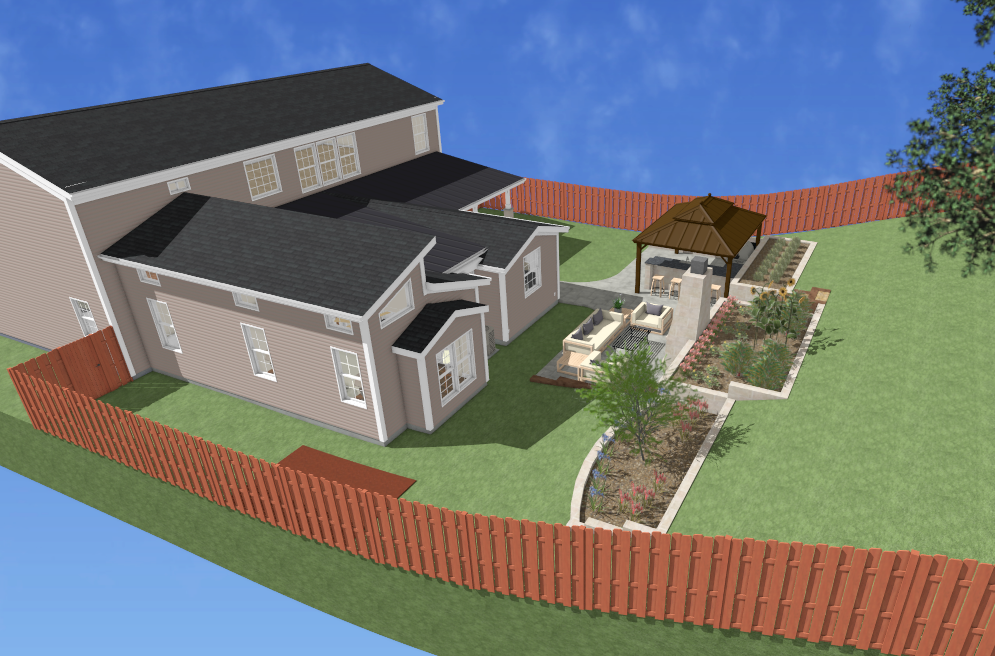 Aerial view of a house with a landscaped, fenced-in yard