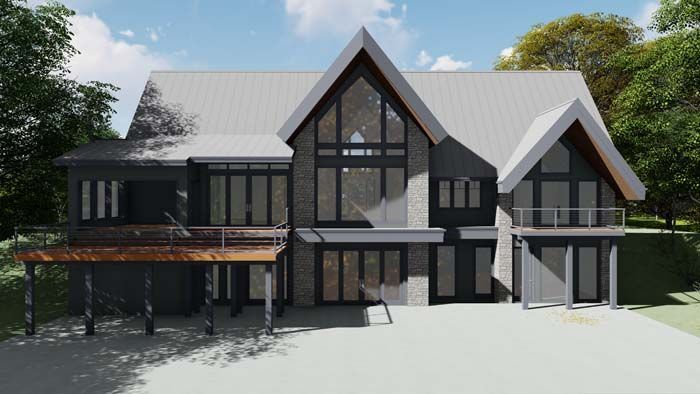 Two story house with steep roofs and large windows