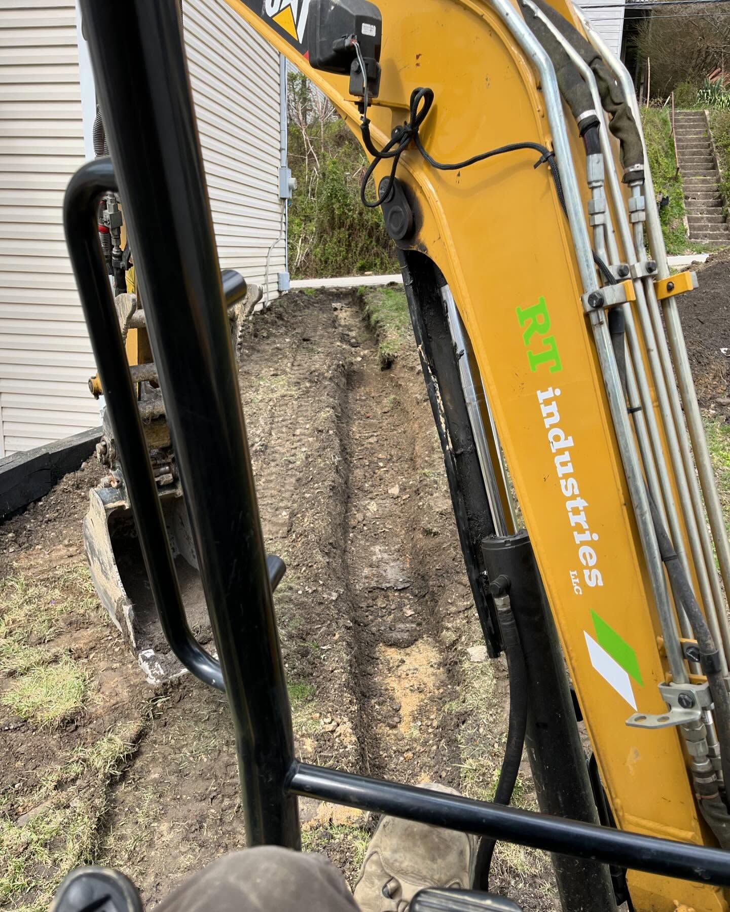 A yellow excavator with the word industries on it