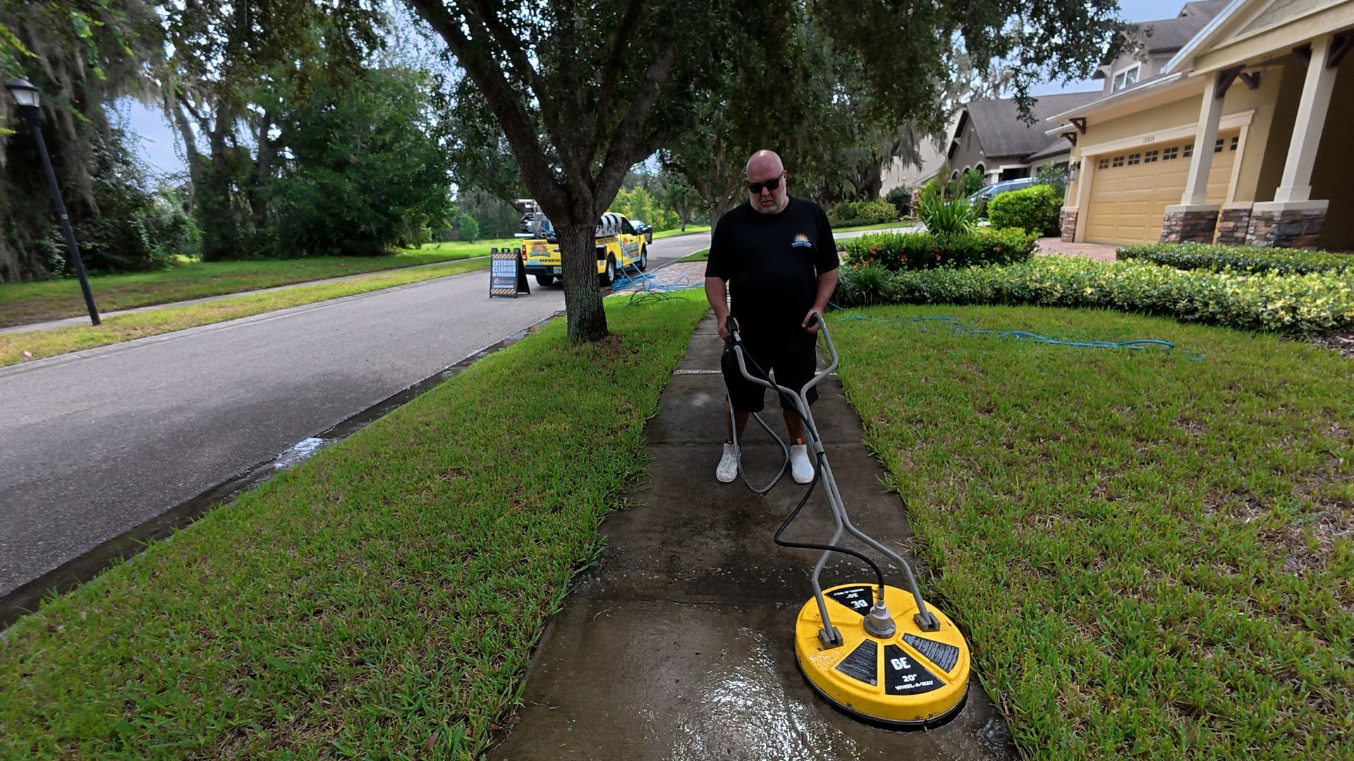 Pressure washing a sidewalk