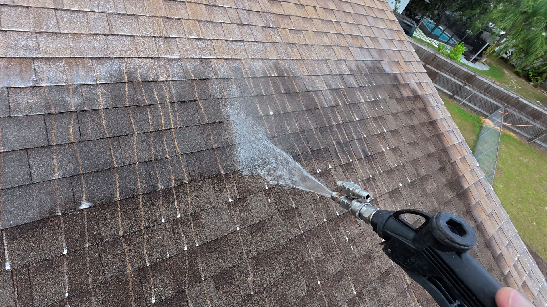 Soft washing a shingle roof