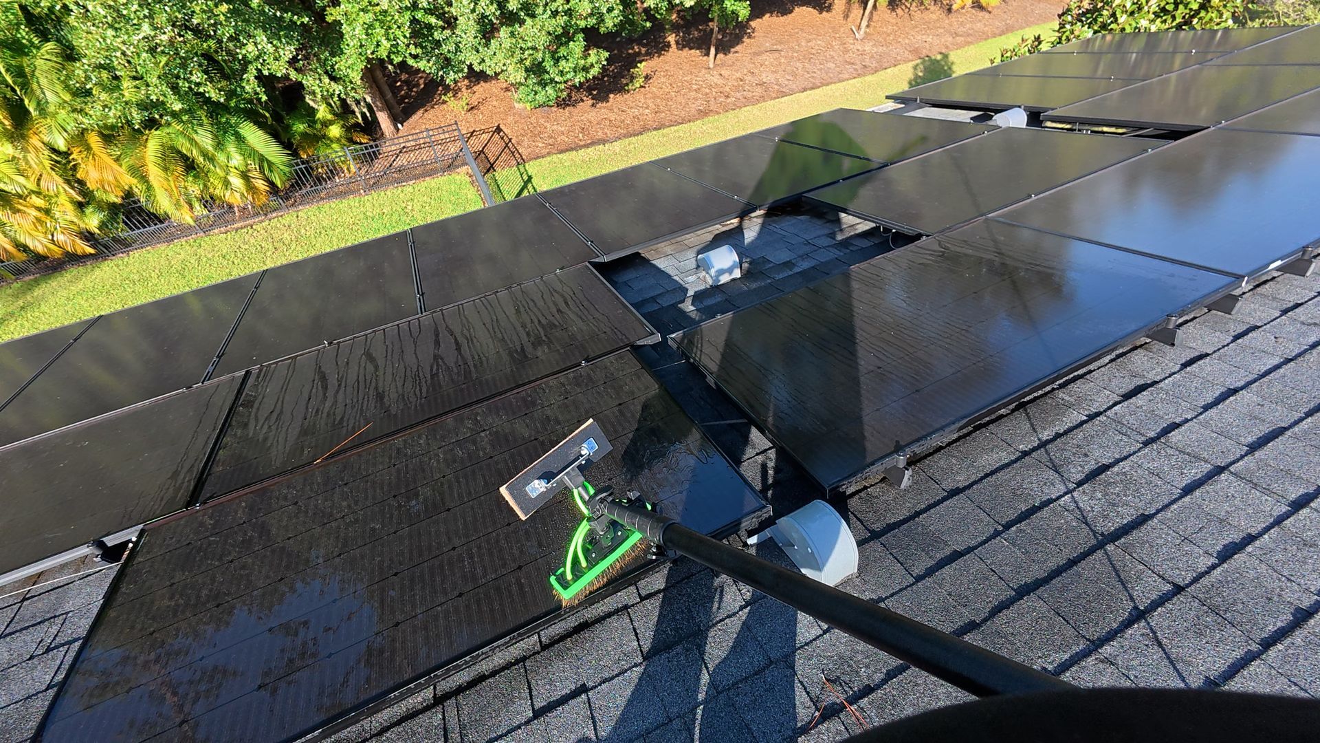 washing solar panels with water fed pole