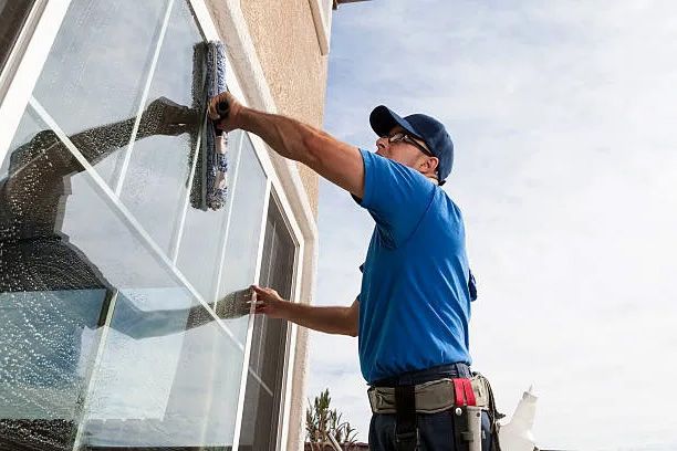 Person cleaning windows