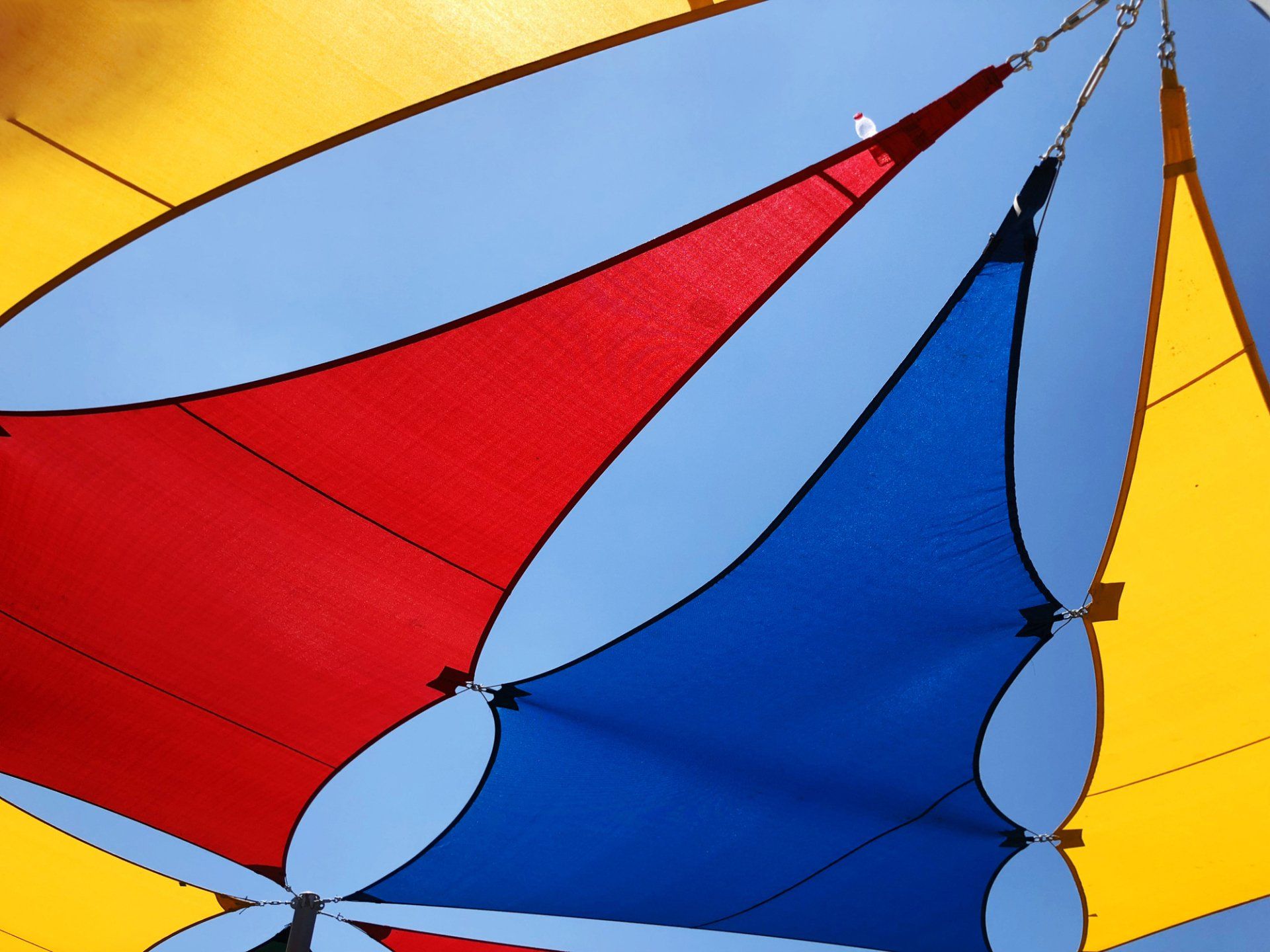 Colourful Shade Sail — Capalaba, Qld — M & M Tarp Repairs Colourful Shade Sail — Capalaba, Qld — M & M Tarp Repairs