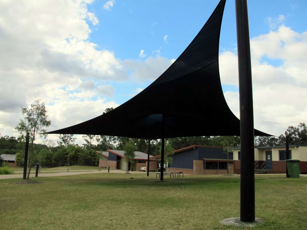 Black Tarp in Ground — Capalaba, Qld — M & M Tarp Repairs