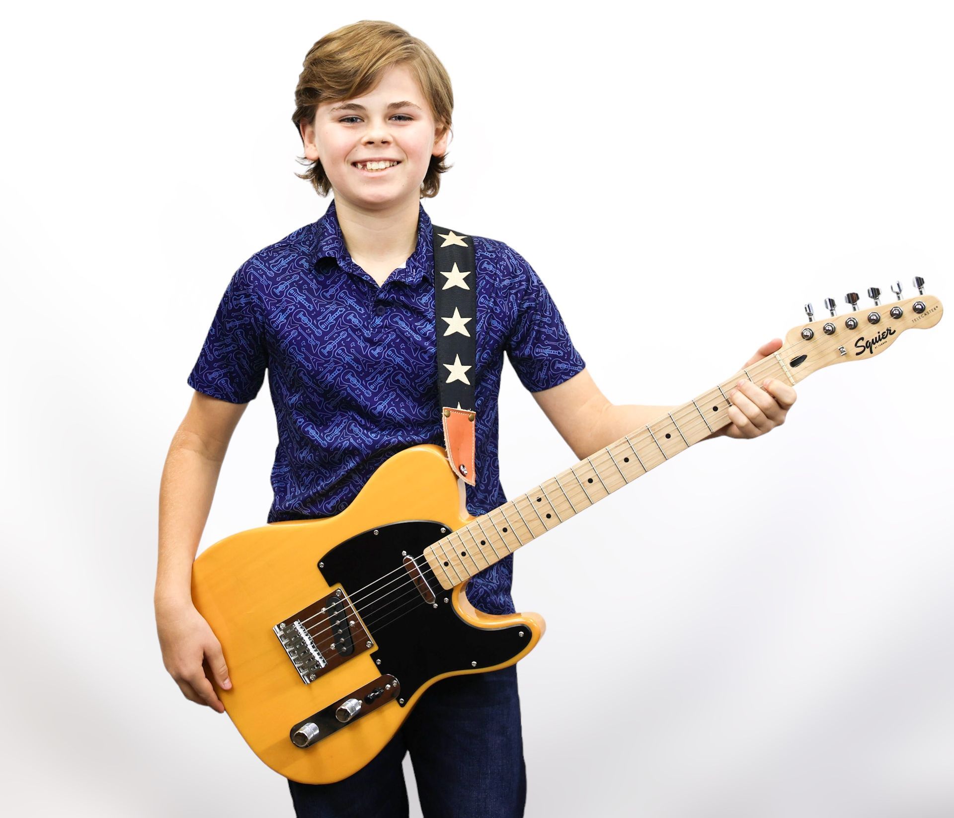 A group of young children standing next to each other holding guitars and drums.