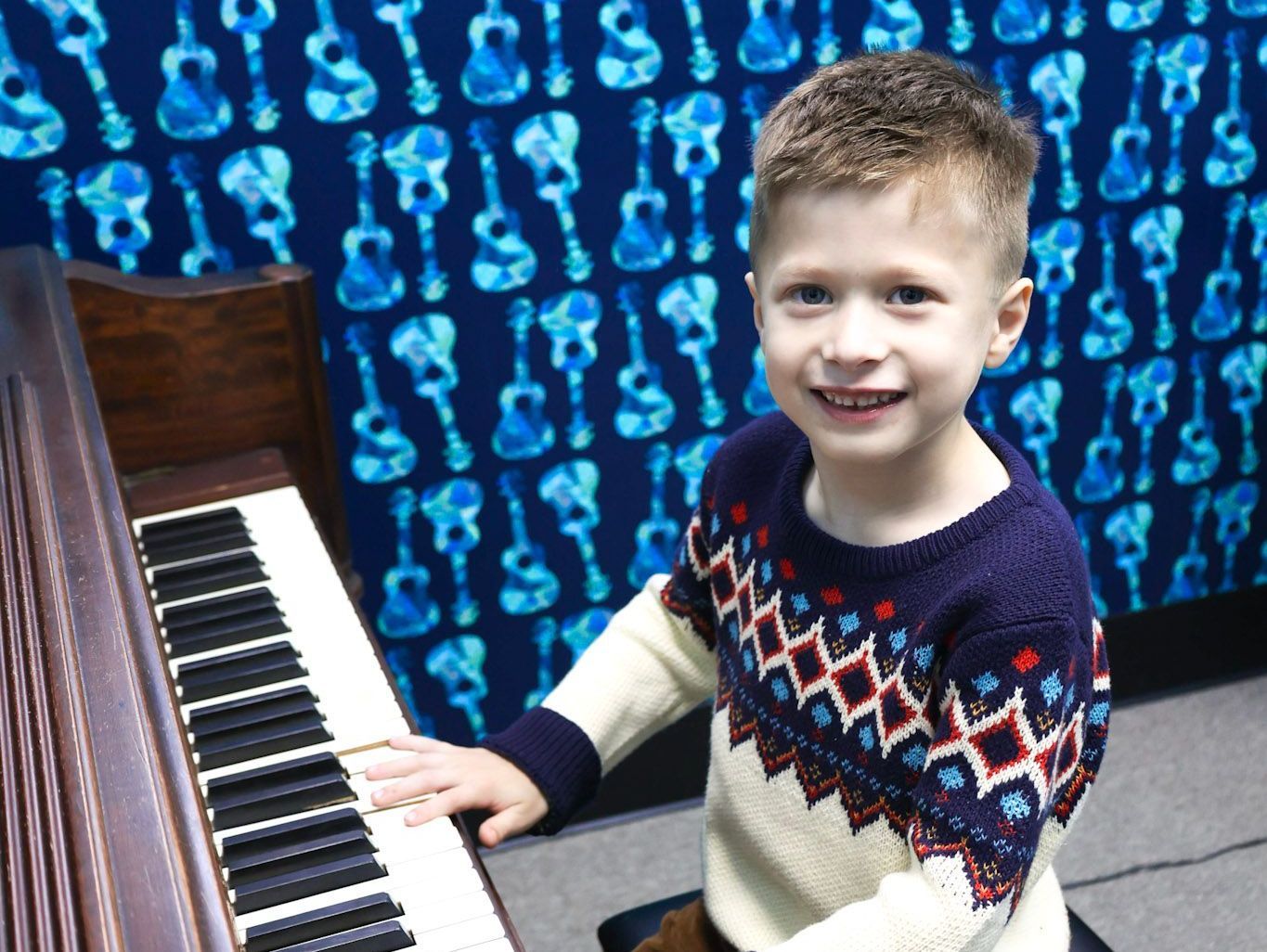 Two women are standing next to each other holding a trophy.