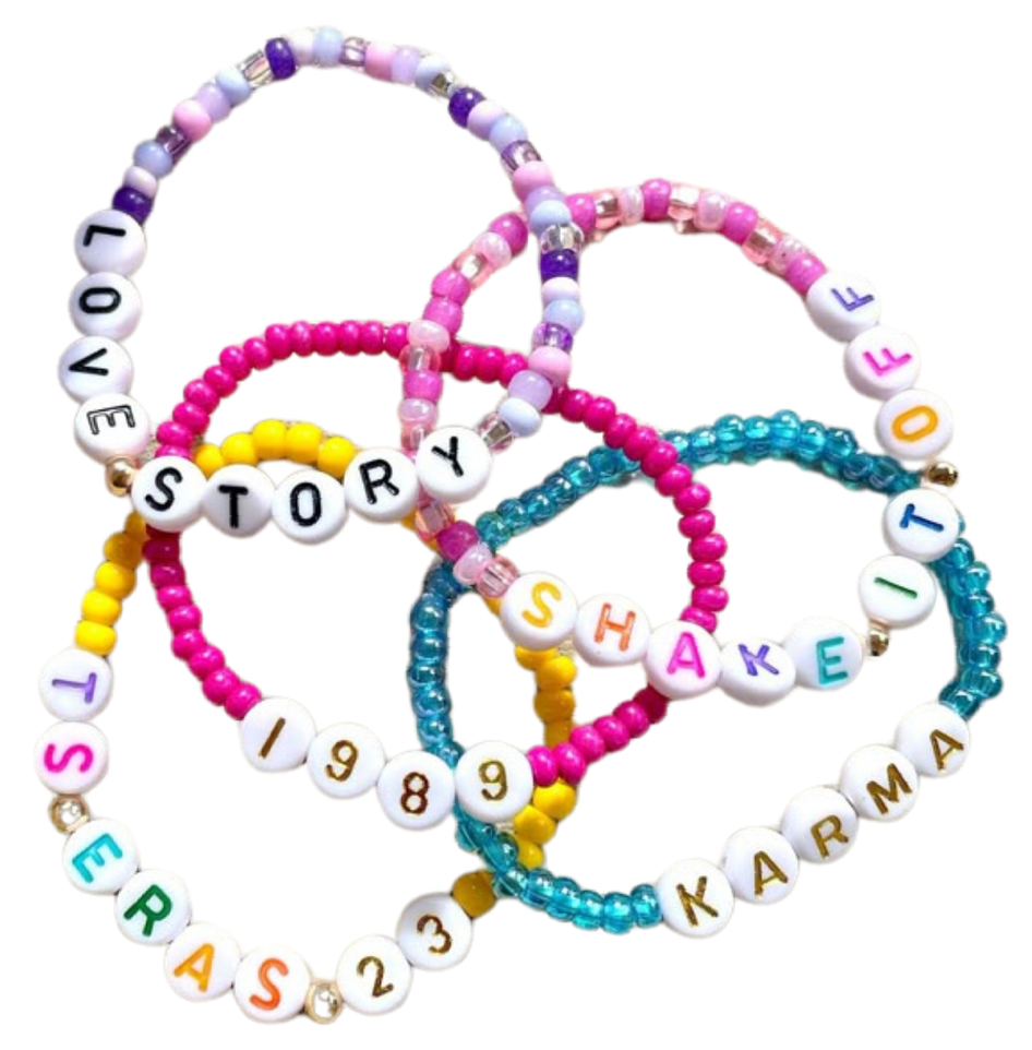 A bunch of bracelets that say love story shake it and karma