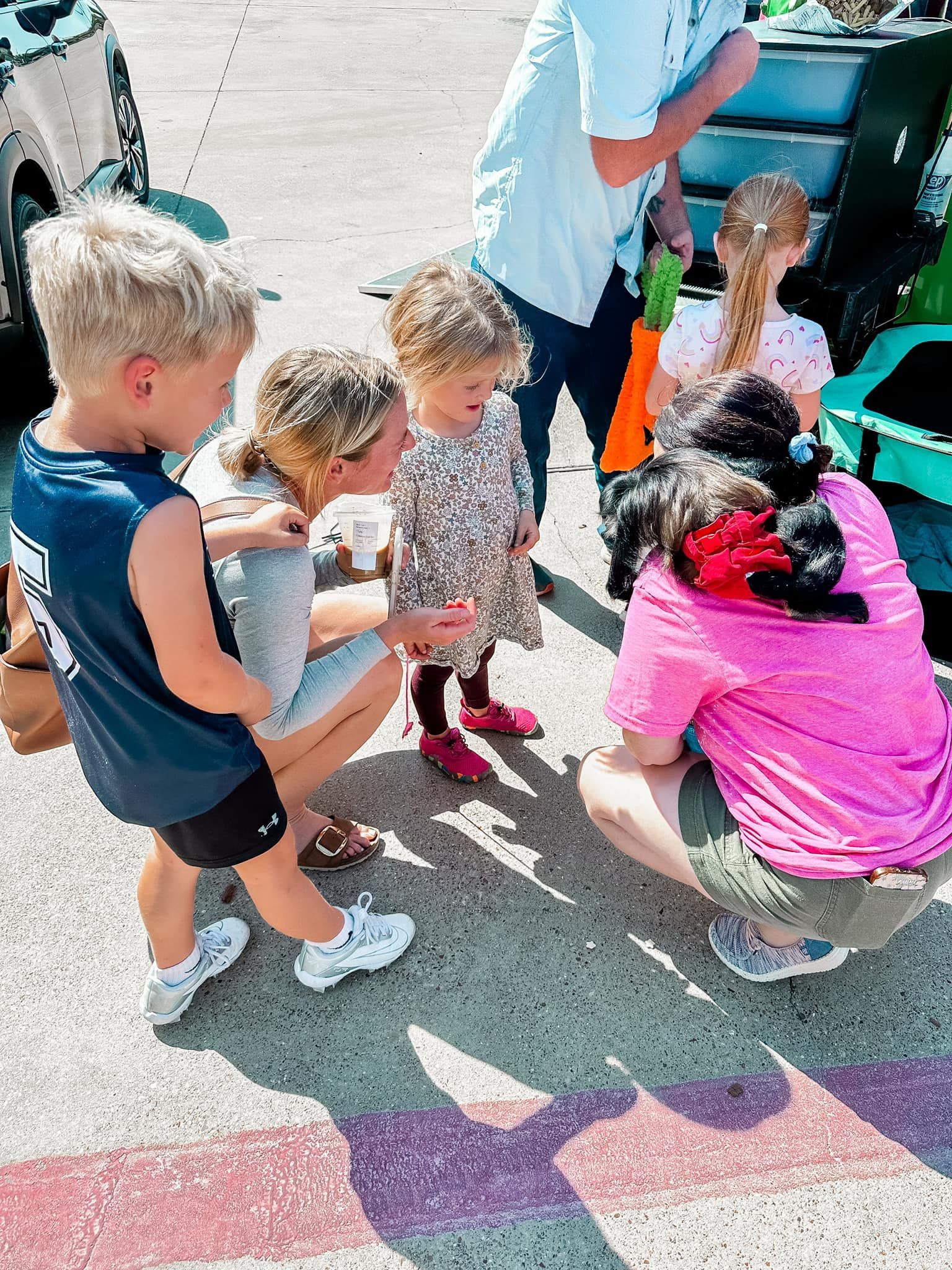 A young boy is playing drums in a dark room.