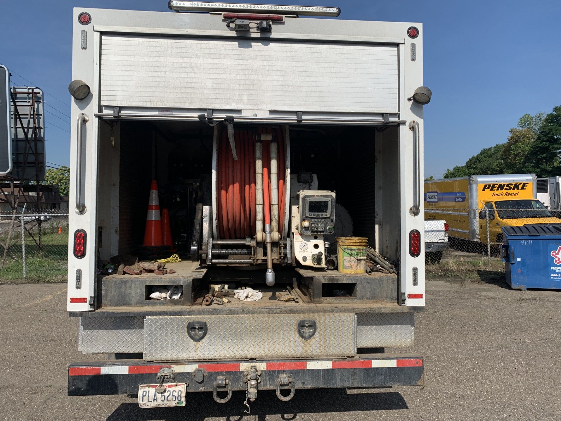 The open back of a white utility truck 
