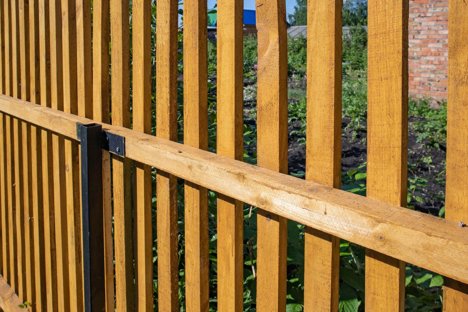 new wooden picket fence