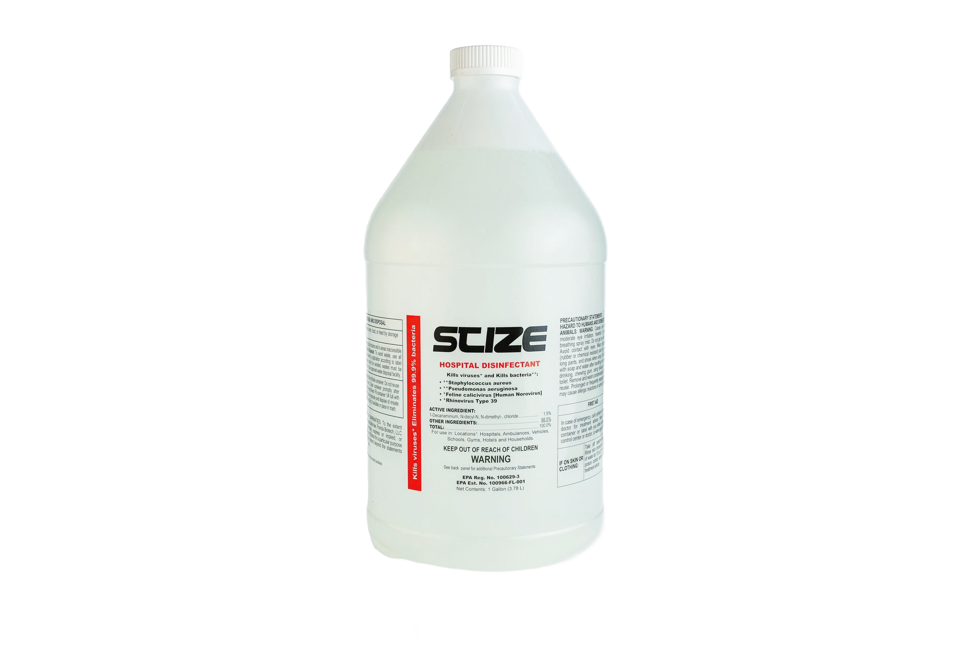 A bottle of scize sits on a rock near a river