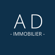 Un logo pour une entreprise appelée ad immobilier sur fond bleu.