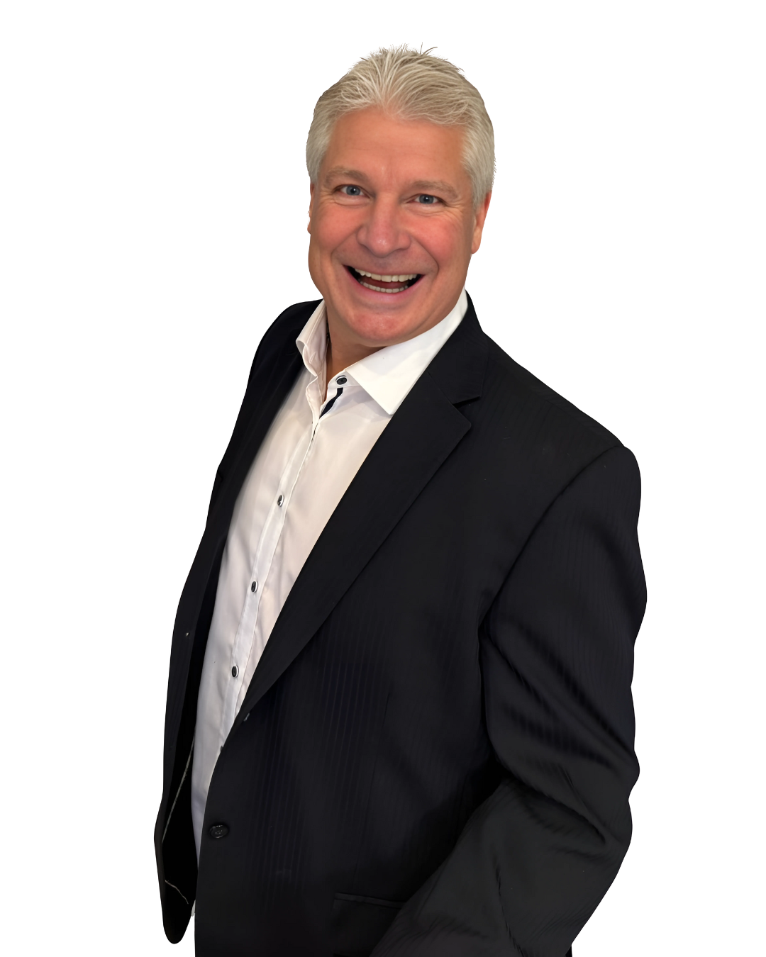 A man in a suit and white shirt is smiling for the camera.