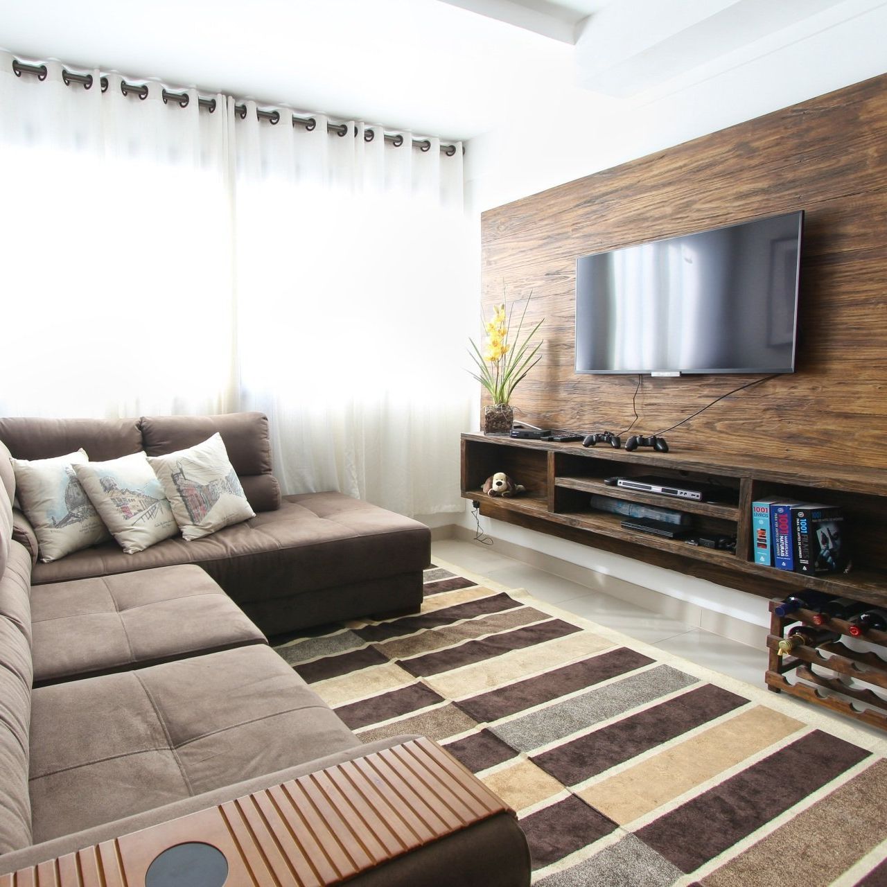 A living room with a couch and a flat screen tv