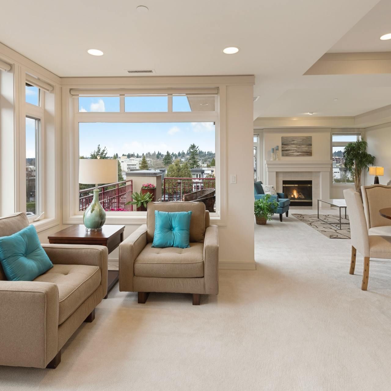 A living room with two chairs and a fireplace