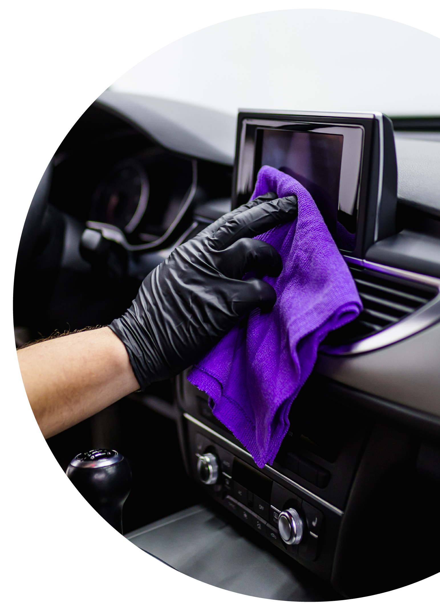 A man cleaning car interior, car detailing (or valeting) concept. Selective focus.