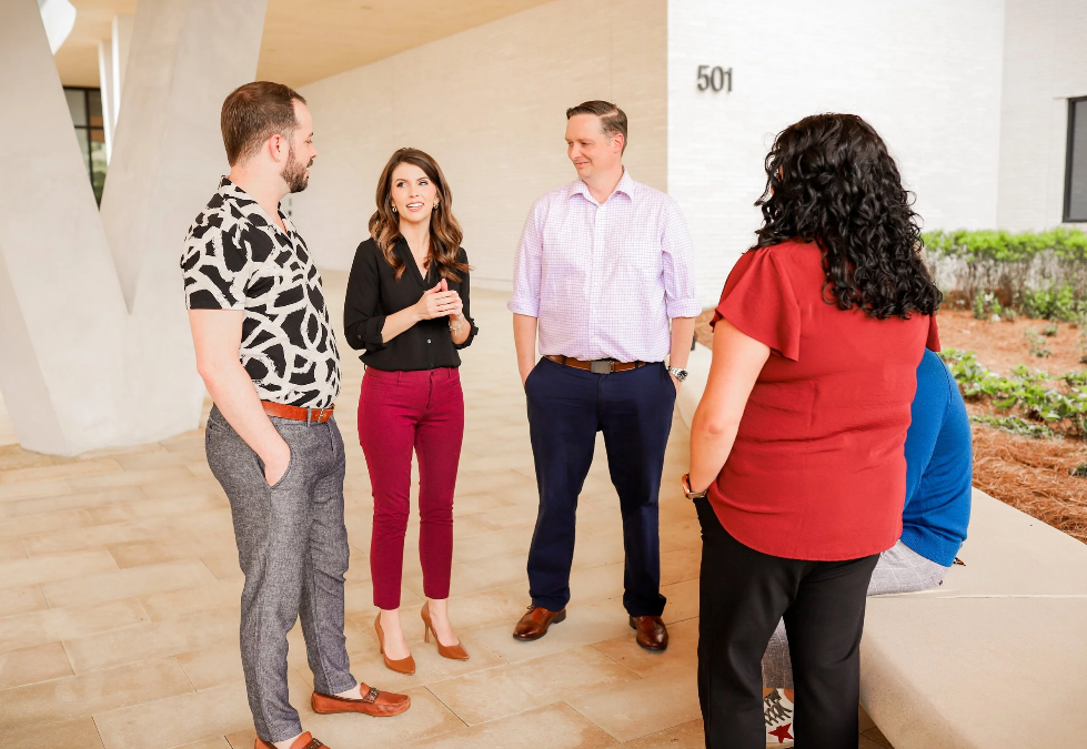 Flexion point team standing and talking
