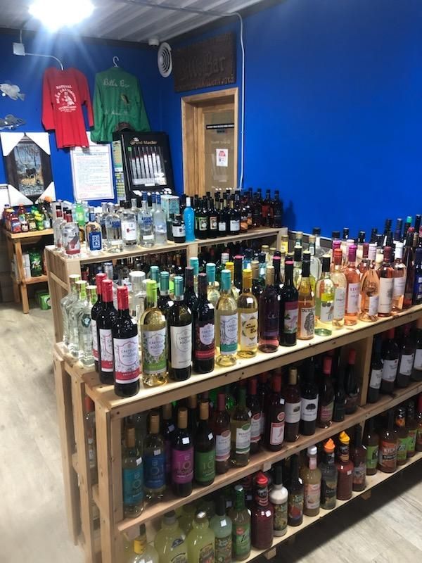 A store filled with lots of wine bottles on shelves