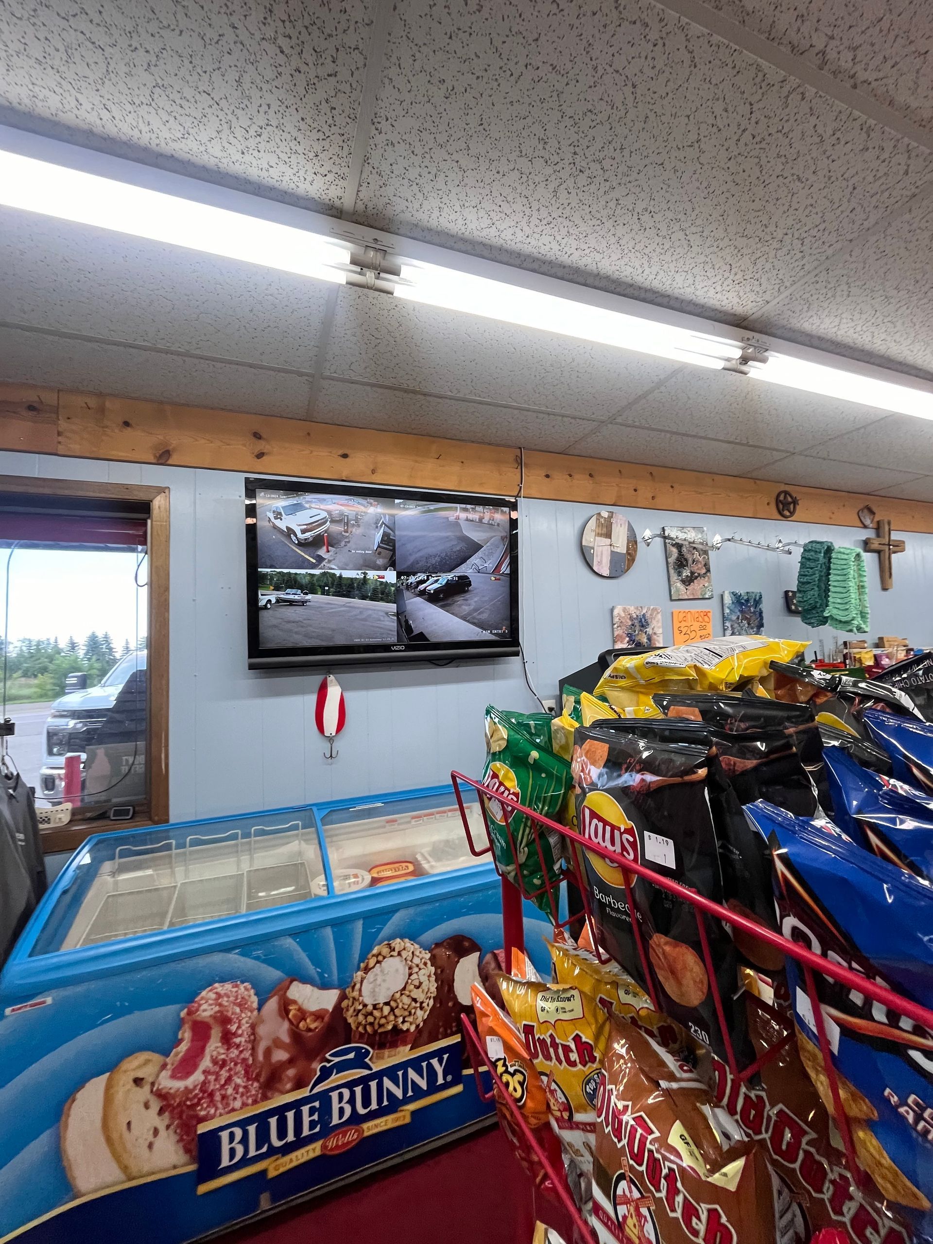 A store filled with lots of snacks including blue bunny ice cream