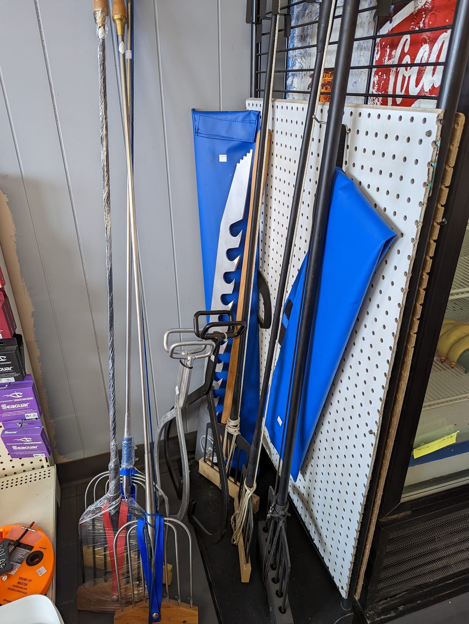 A bunch of umbrellas are hanging on a rack in a store