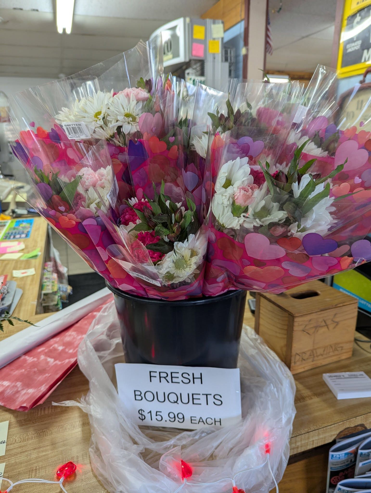 A bunch of flowers in a vase on a table.