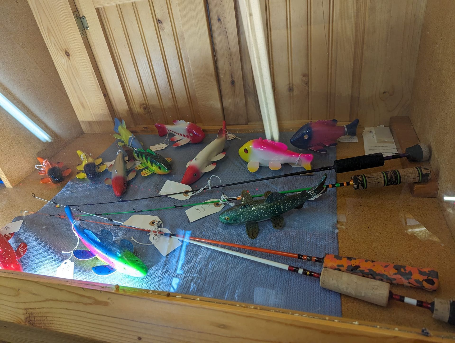 A table with fishing rods and fish on it