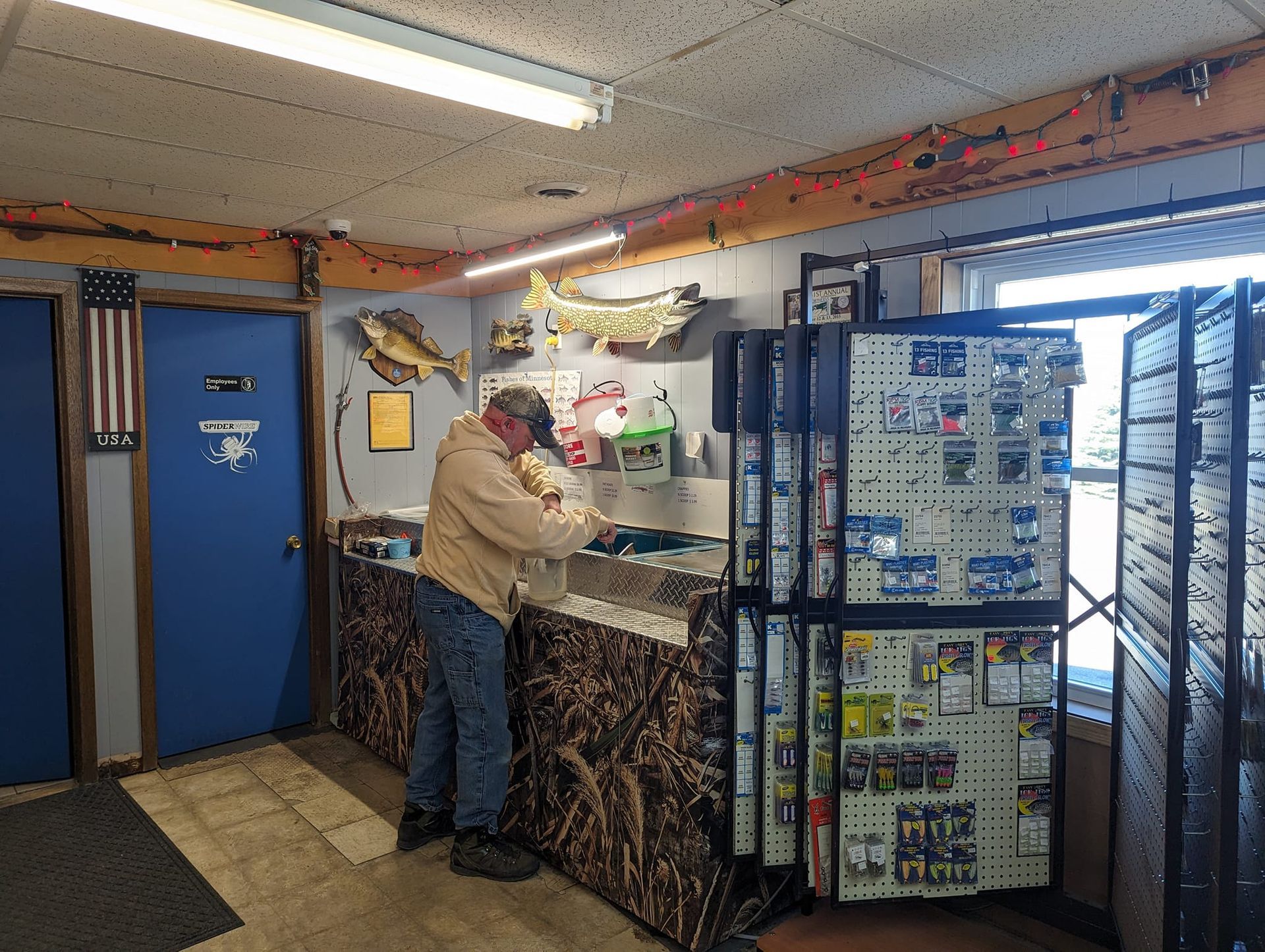A man is standing at a counter in a store.