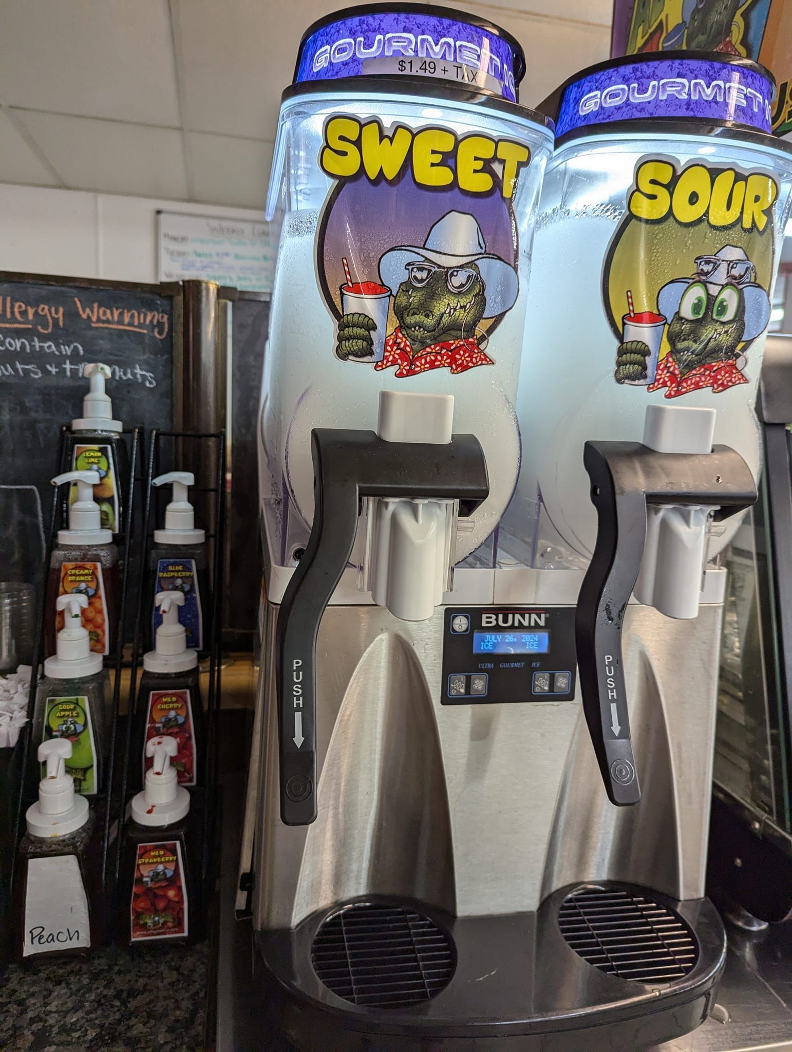 Two sweet and sour machines are sitting next to each other in a room.