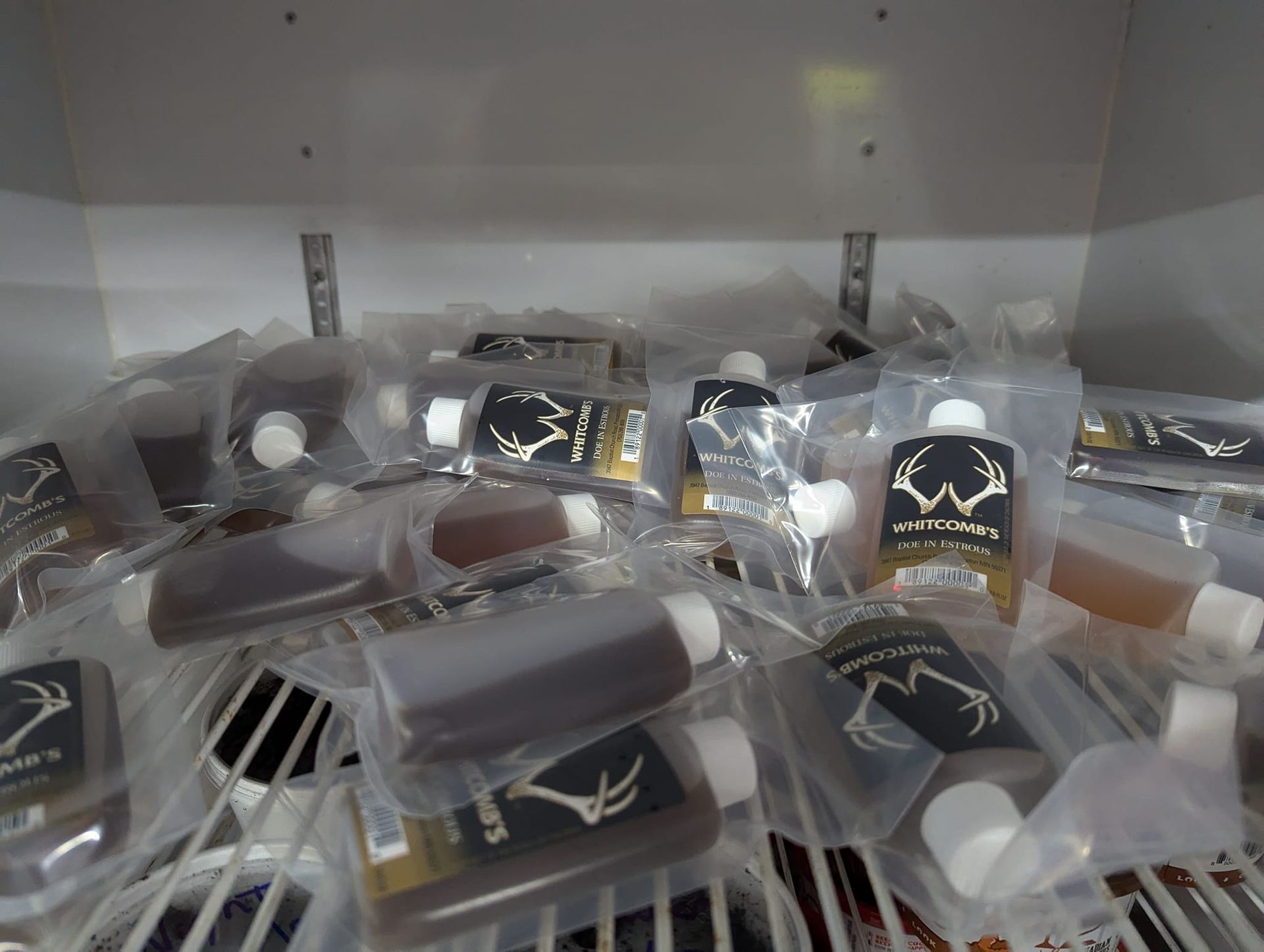 A bunch of small bottles with a deer head on them