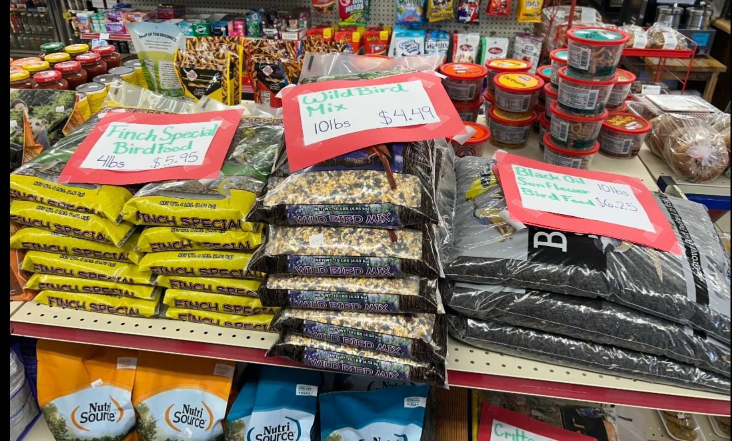 A store shelf filled with lots of food and snacks.