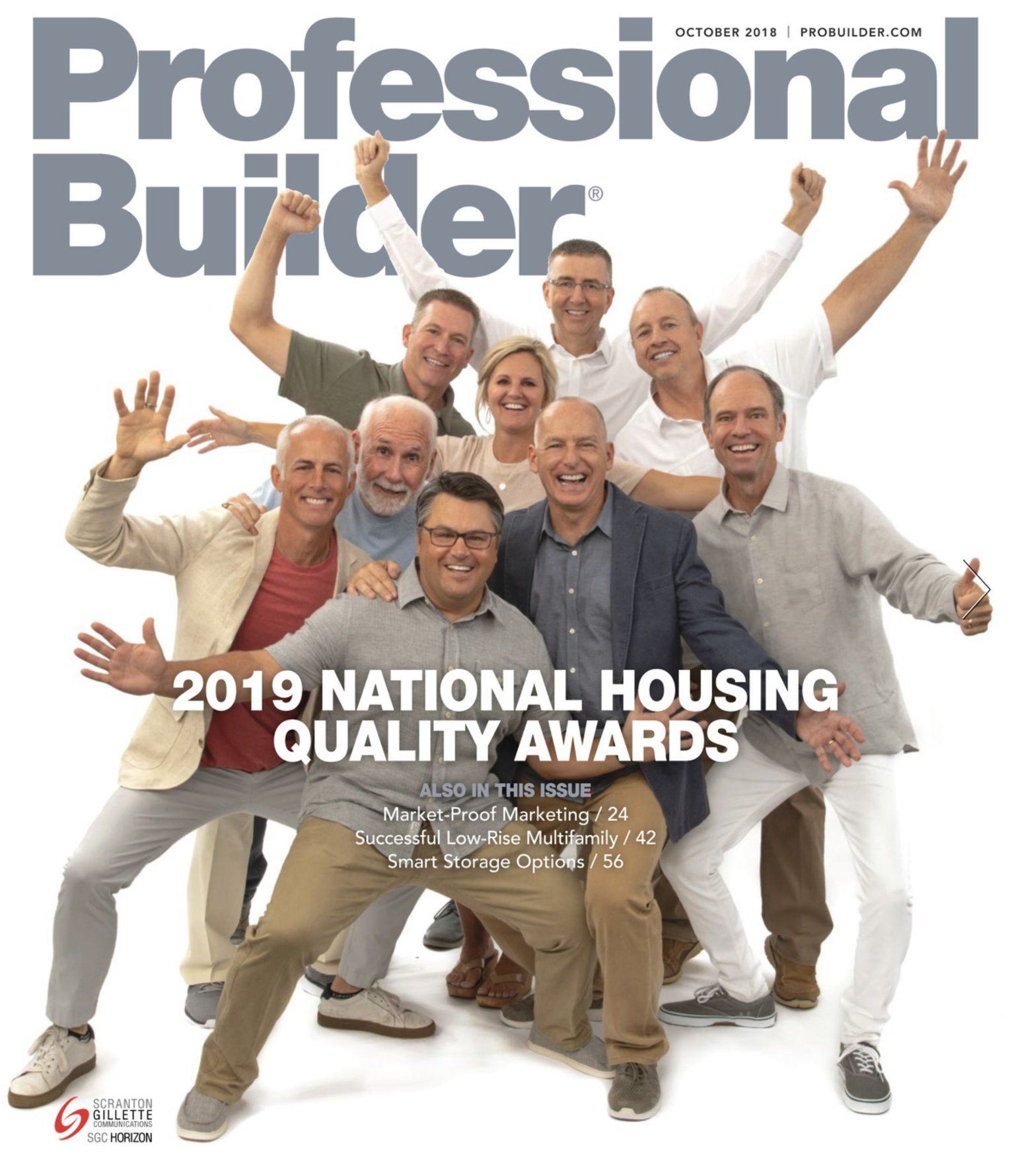 A group of people are posing for a picture on the cover of a professional builder magazine.
