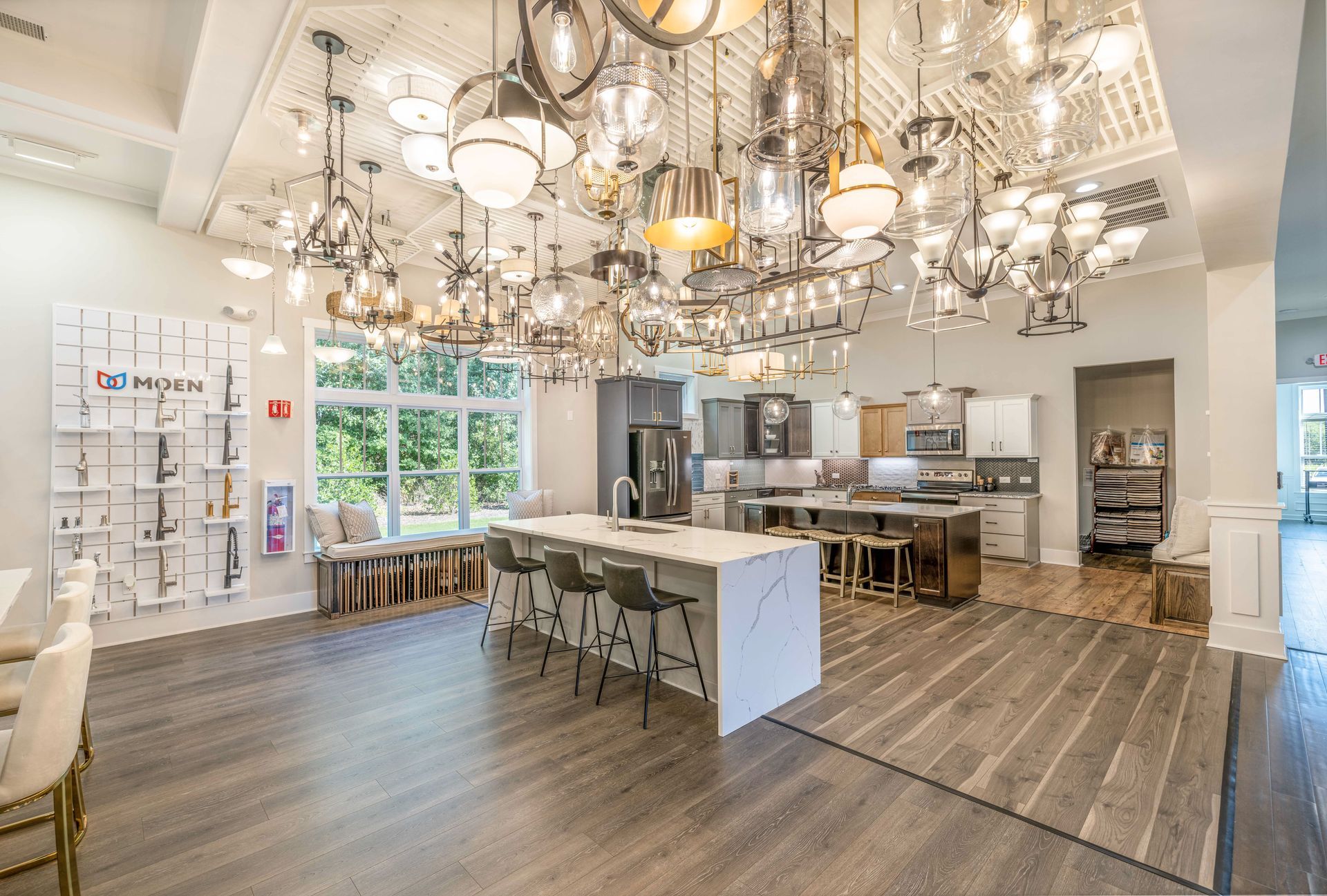 A kitchen with a lot of lights hanging from the ceiling.